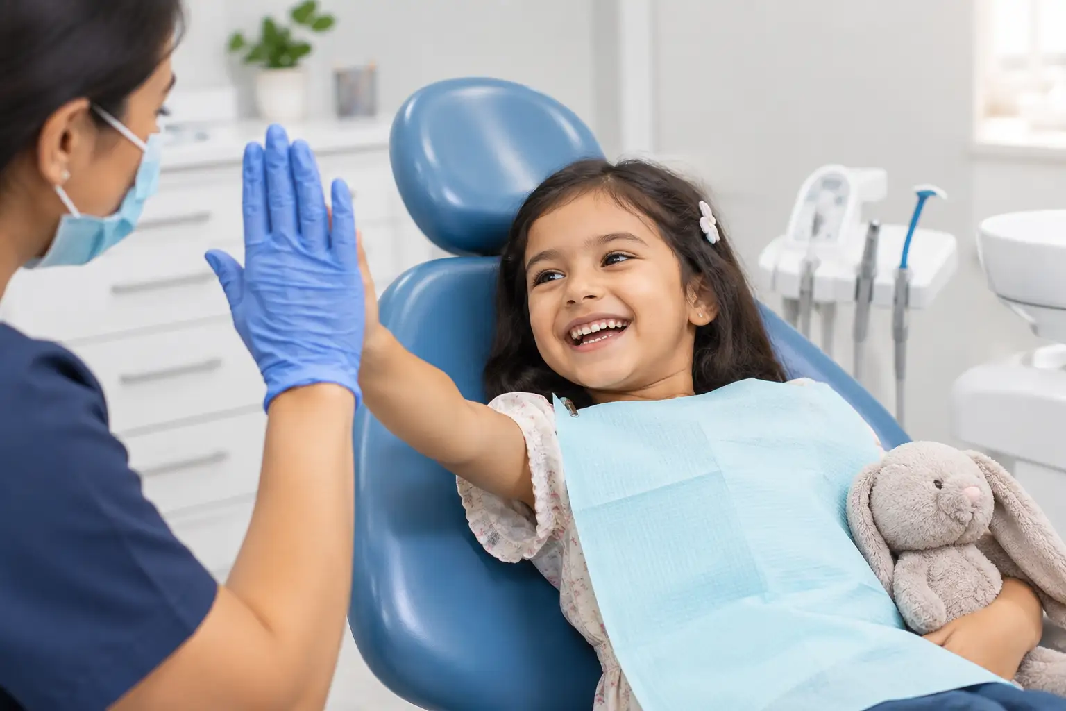 Child-receiving- a-comfortable-dental-check-up-from-a-pediatric-dentist-in-a-modern-dental-clinic