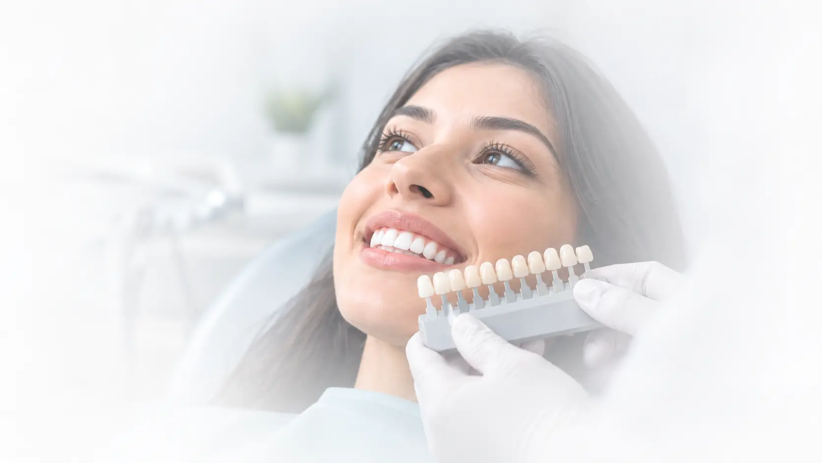 smile-design-treatment-patient-smiling-with-dental-shade-guide